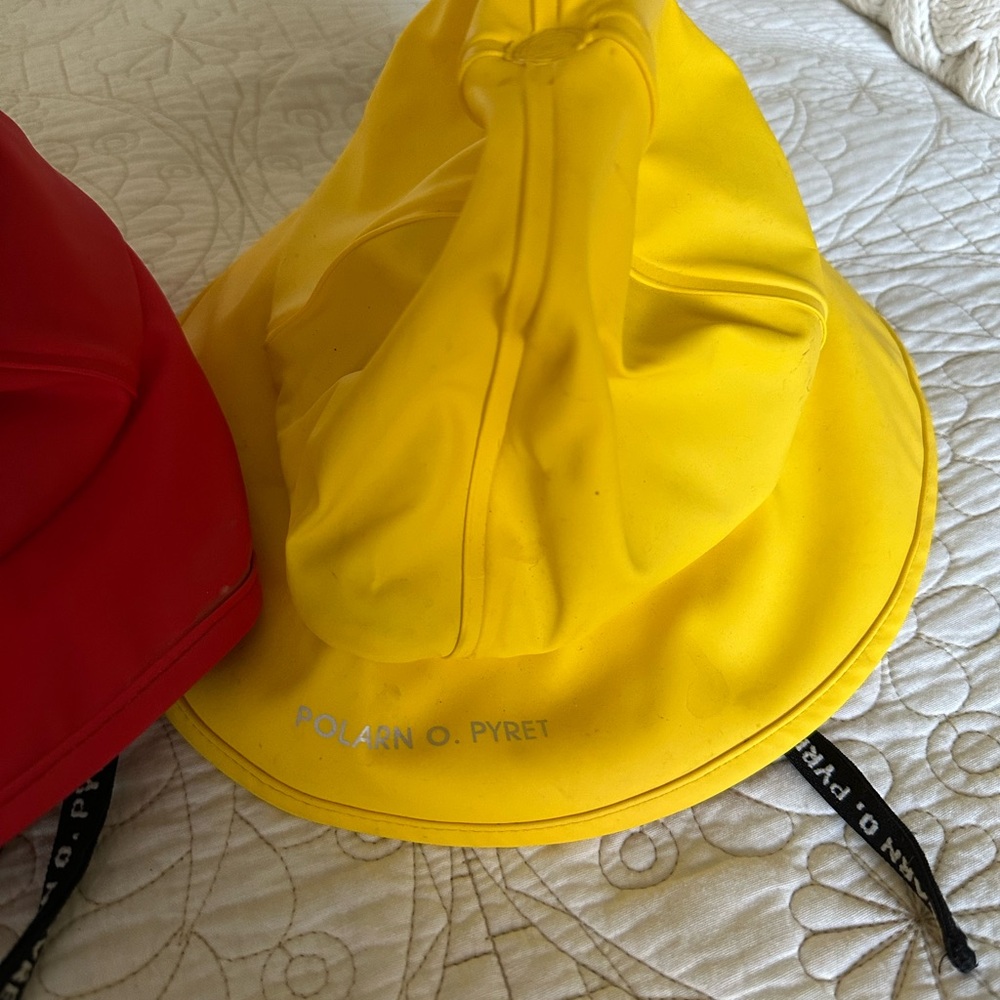 Polarn O. Pyret Yellow and Red Rain Hats